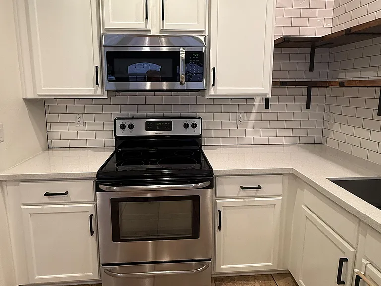 Fully updated kitchen with modern finishes and ample storage.