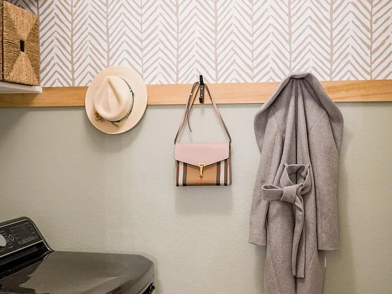 Laundry room doubles as mudroom / drop zone between the 2-car garage and the kitchen