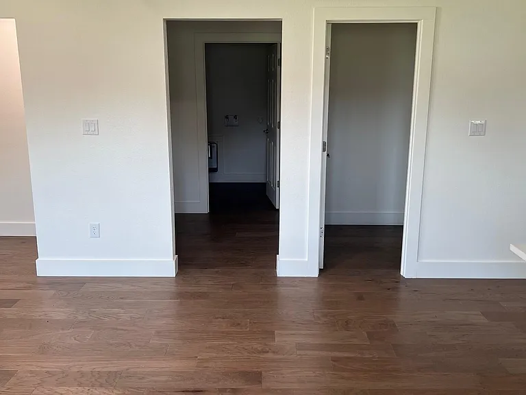 Option for office through left door. The 2nd door is a laundry room with washer/dryer connections. Door on the right is pantry/storage