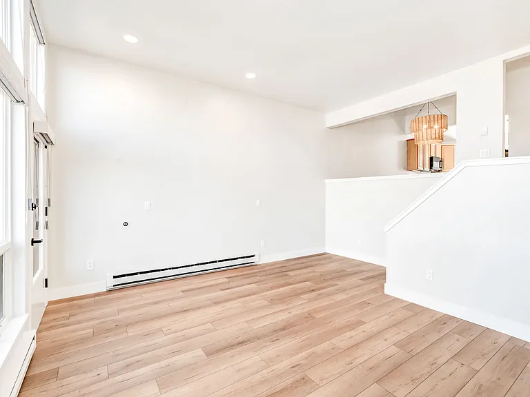 Living room with gas fireplace and walk out to back deck.
