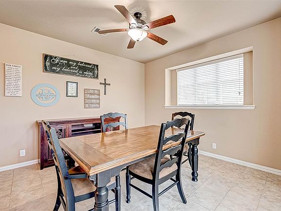 Another view of the formal dining room with a generous amount of wall space for your personal touches.