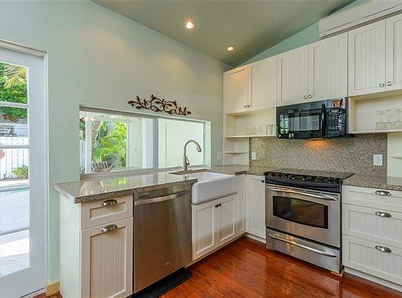 Kitchen conveniently located to backyard pool area.