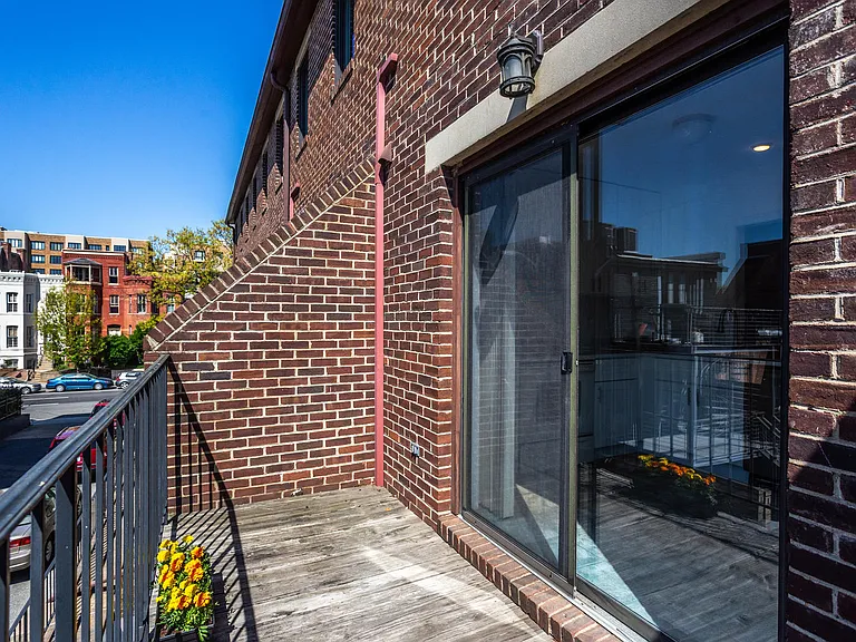 Private, sunny, south-facing balcony elevated above street level.