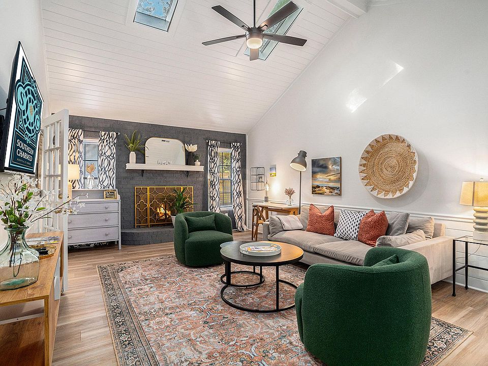 Spacious living area with Smart TV and workspace with desk and chair