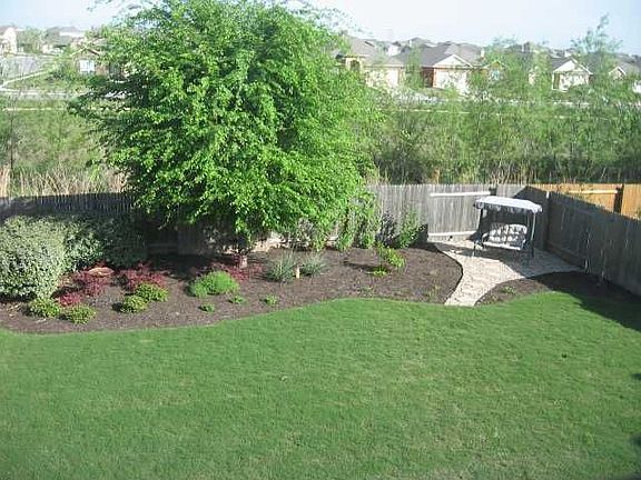 Yard backs up to greenbelt.