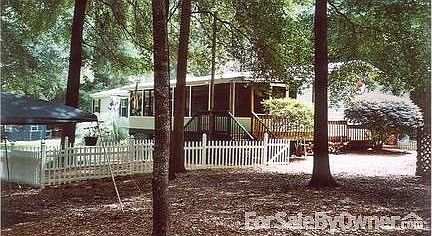 Elevated screened back porch : Our favorite place to watch the wildlife in the woodlands behind our 