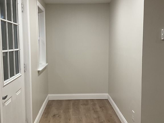 Front door entry, left side of living room.