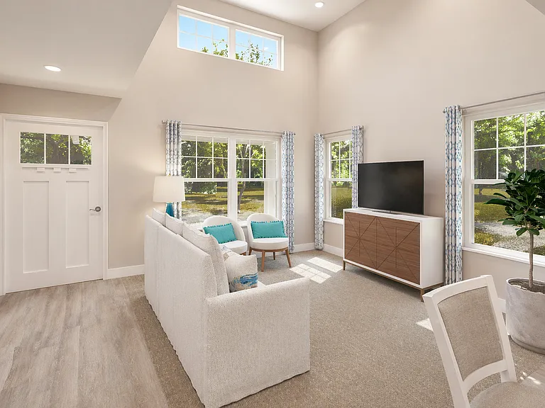 Open-concept living area with abundant natural light, high ceilings, and seamless flow for relaxing or entertaining.