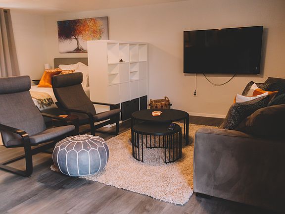 With a large TV and comfortable couch and chairs, you'll love watching your favorite movies here.