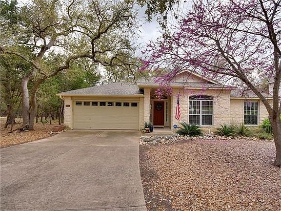 Charming limestone 3/2 on wooded section of Point Venture golf course.