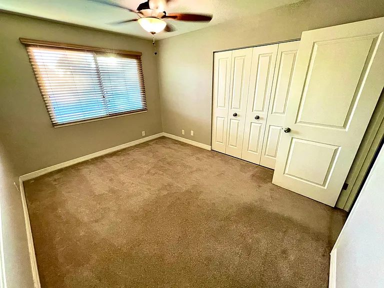 bedroom two with ceiling fan