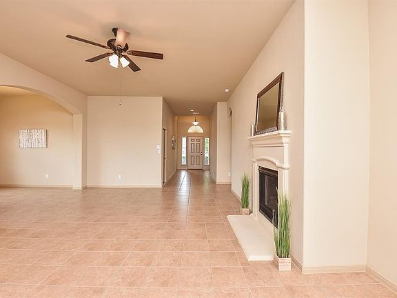 The spacious family room has a cast stone gas fireplace and is a nice focal point for this living space.
