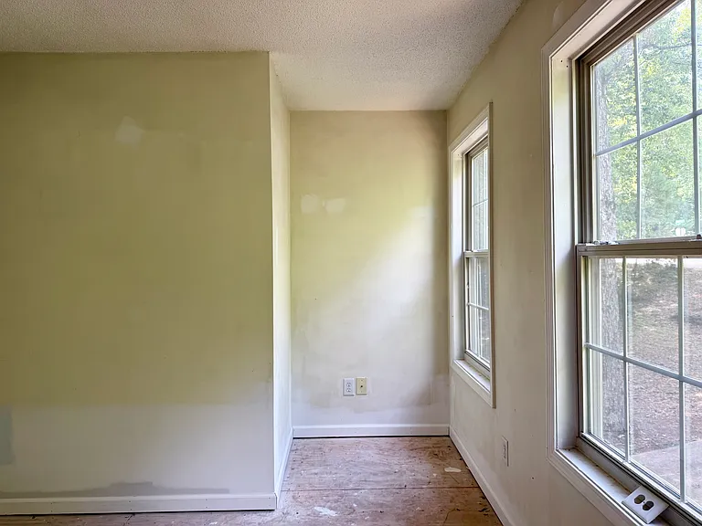 Master bedroom nook perfect for a reading chair or small office area.