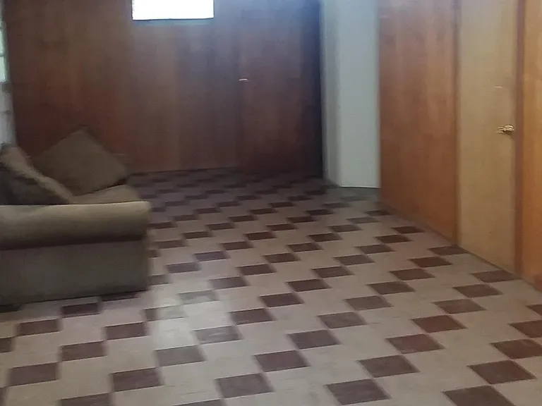 Basement with extra bedroom (not listed) and door to the back yard