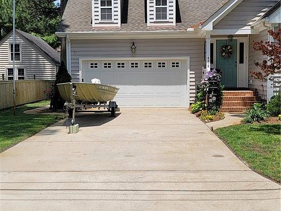 2 CAR ATTACHED GARAGE WITH SPACIOUS ROOM ABOVE!