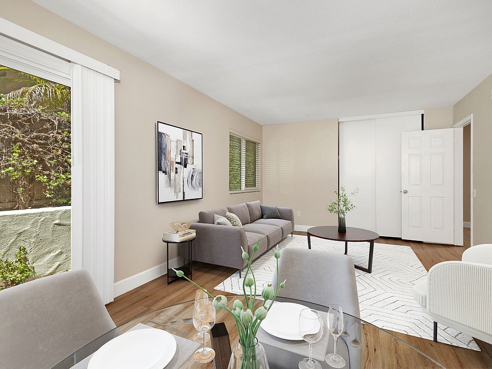 Virtually staged photo of living room and dining area