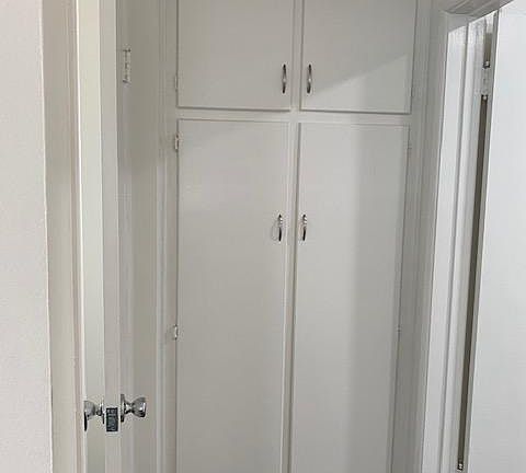 hallway and closets between bedroom and bathroom