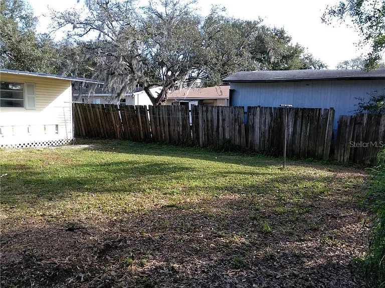 Shared backyard with detached studio.