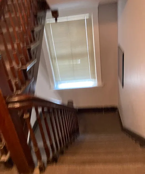 Original staircase leading up to Apt #3
