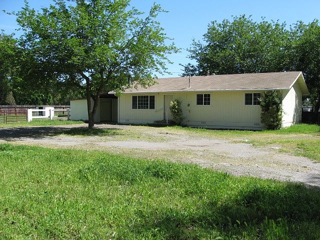 Front w/ circular driveway