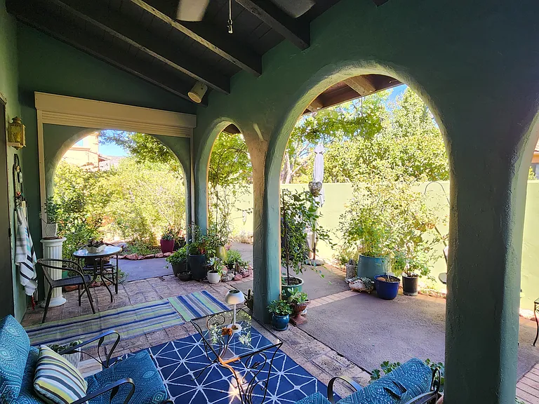 Covered back patio has fans and access from living room and master bedroom.