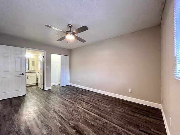 Experience tranquility in this modern bedroom with sleek design and natural light.