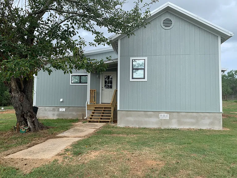 West entrance into mud room and into kitchen.