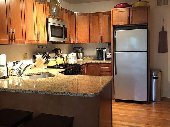 Kitchen (includes gas range, dishwasher, granite countertops).