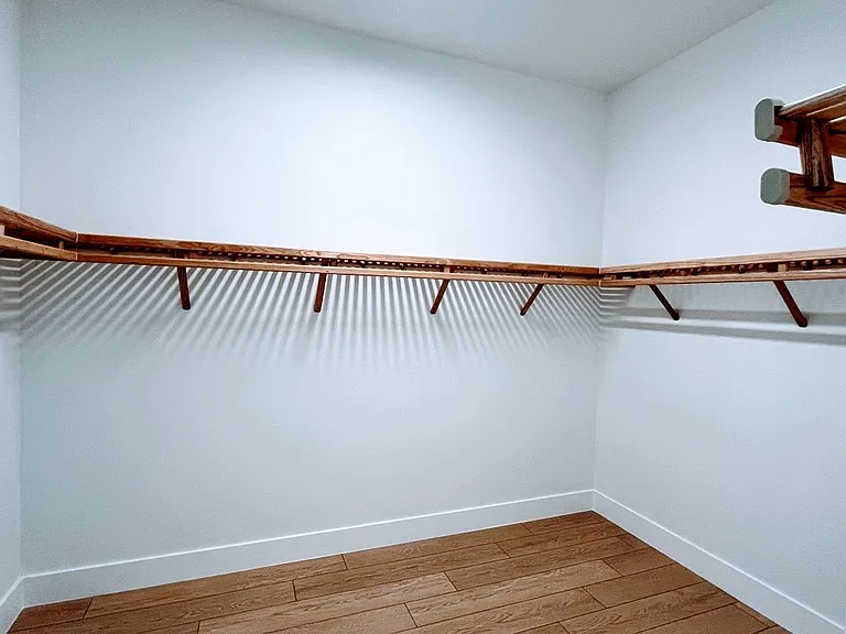 2 separate walk-in closet for him and her. One shown here.