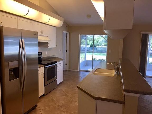 Kitchen with New Appliances and Corian Counters