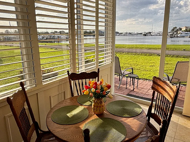Dining room shown with plantation doors shut, louvers open