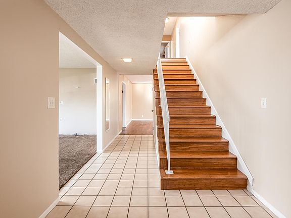 Entry with elegant stairs