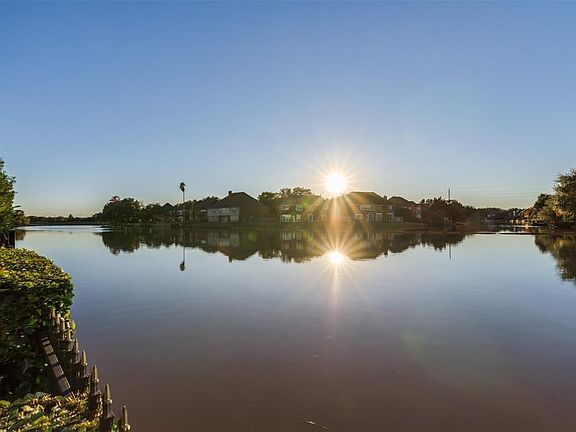 Magnificent Views are afforded from this handpicked Premium Lot with Panoramic Water Views of Oyster Creek. Enjoy Spectacular Sunsets from the Second and Third Level Balconies along with enthralling views from the Primary Bedroom located conveniently