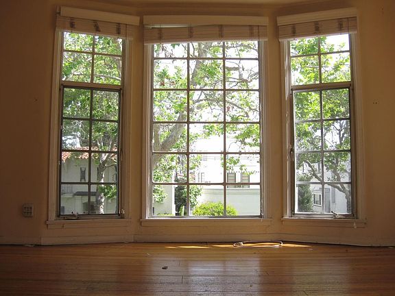 Living room. Large French window at the background.