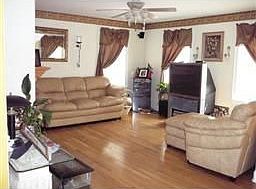 Spacious living area, marble-accented fireplace