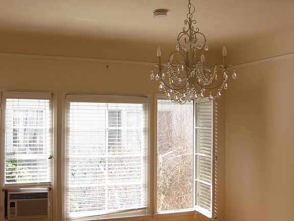 Bedroom with chandelier.