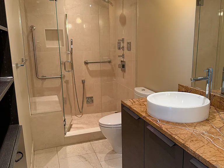 bathroom with updated spa shower
