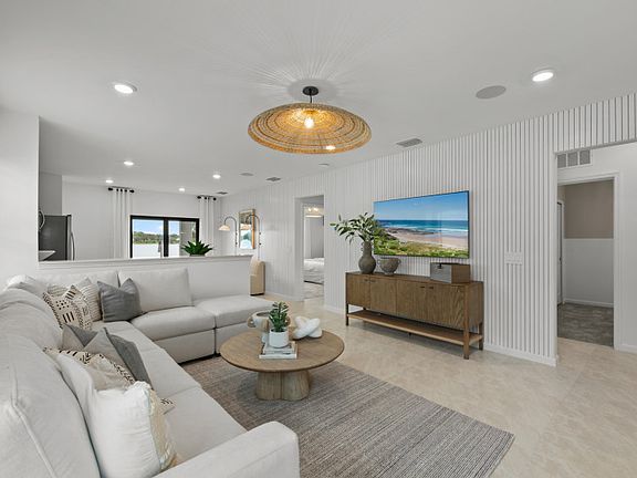 Spacious gathering room flowing into the kitchen and cafe area