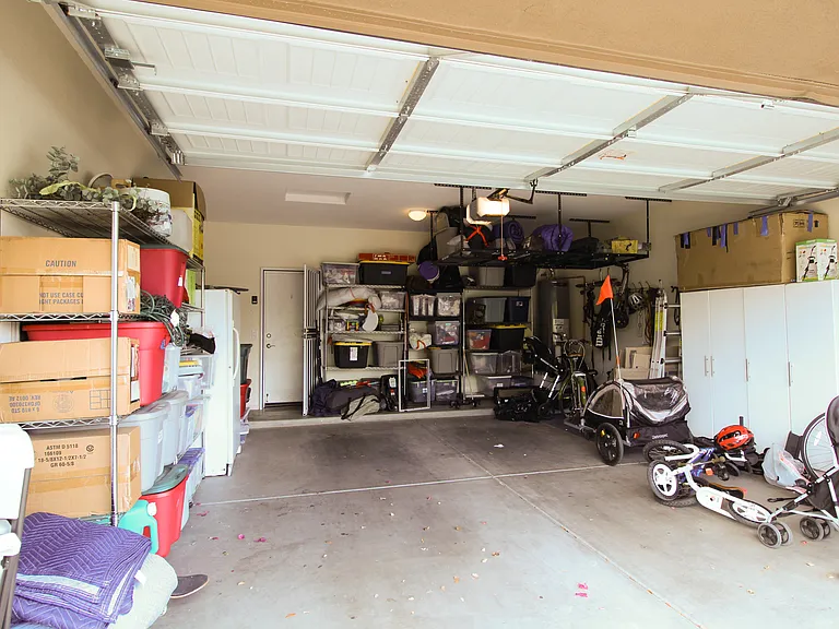 So much room for storage, including included overhead metal shelving