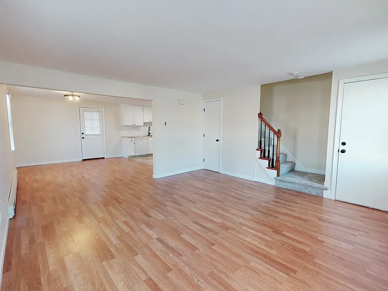 Spacious and bright living-room with elegant railing to 2nd floor. Designer luxury vinyl plank flooring!