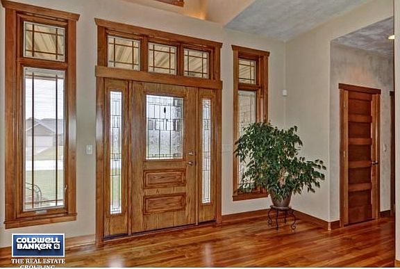 Warm wood tones, bright foyer