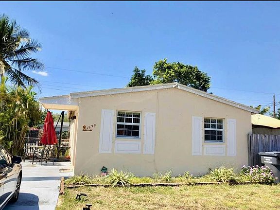 Table with umbrella on left and a Gazebo on right side of pr