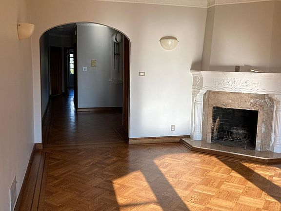 Decorative Fireplace in Living Room with view of hallway