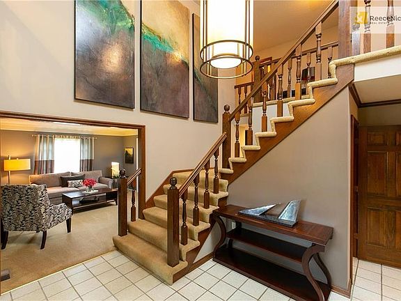 Dramatic Foyer with Soaring Ceiling Featuring Fabulous Wall for Art Work