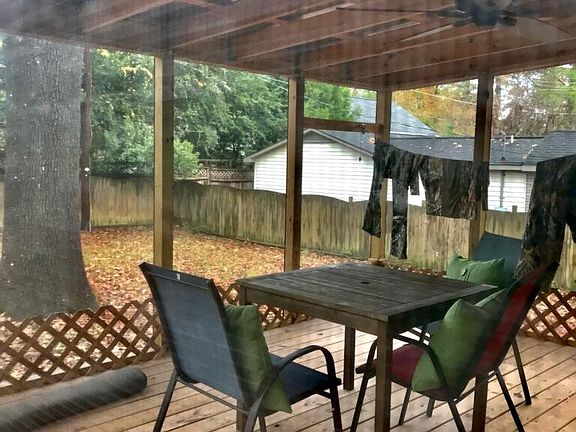 Screened in back porch and fenced back yard
