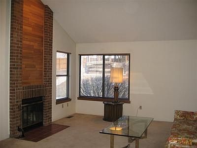 Living Area with plenty of light and cozy fireplace