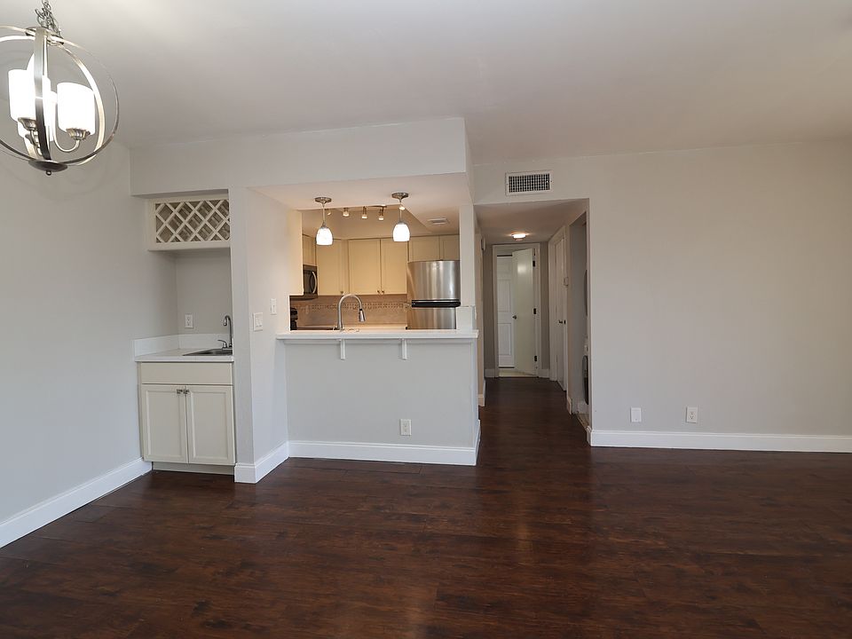 View of dining area and kitchen from front door