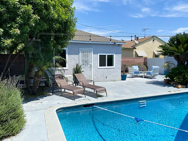 other tenant/separate unit in the backyard, on the left in this photo.