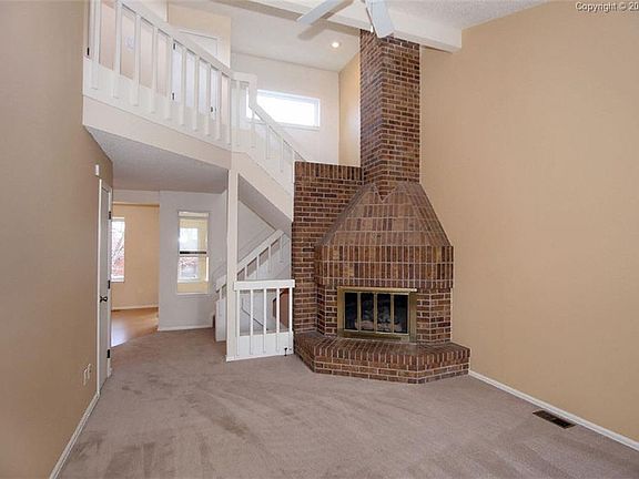 Living room with gorgeous brick fireplace