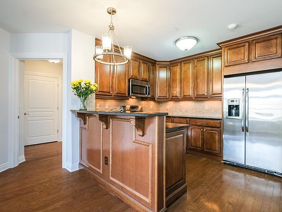OPEN KITCHEN WITH SS APPLIANCES AND BREAKFAST BAR!